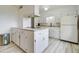 Bright kitchen with white cabinets, sleek countertops, and modern appliances for a clean and functional cooking space at 1059 E 9Th Ave, Mesa, AZ 85204