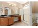 Bathroom with vanity and walk-in shower with glass door at 1072 E Jade Dr, Chandler, AZ 85286