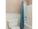 Bathroom with a toilet and shower featuring a blue towel at 1072 E Jade Dr, Chandler, AZ 85286