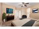 Cozy bedroom with neutral tones, a ceiling fan, and stylish furnishings create a relaxing atmosphere at 1072 E Jade Dr, Chandler, AZ 85286