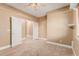 Spacious bedroom featuring an open closet, carpet floors, and neutral paint at 1072 E Jade Dr, Chandler, AZ 85286