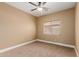 Cozy bedroom with carpet flooring, ceiling fan, and window at 1072 E Jade Dr, Chandler, AZ 85286