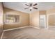 Bedroom with ceiling fan, carpeted floors, and natural light at 1072 E Jade Dr, Chandler, AZ 85286