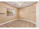 Cozy bedroom featuring a ceiling fan, carpet floors, and a window with natural light at 1072 E Jade Dr, Chandler, AZ 85286