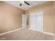 Bedroom featuring carpet, a ceiling fan, and closet with sliding doors at 1072 E Jade Dr, Chandler, AZ 85286