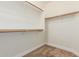 Walk-in closet with carpet flooring and wooden closet rods for organized storage at 1072 E Jade Dr, Chandler, AZ 85286