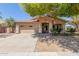 Charming single-story home with desert landscaping, covered entry, and a two-car garage at 1072 E Jade Dr, Chandler, AZ 85286
