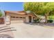 Beautifully landscaped home with a spacious driveway and a charming covered entrance at 1072 E Jade Dr, Chandler, AZ 85286