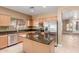 Bright kitchen featuring an island, stainless steel appliances and breakfast bar at 1072 E Jade Dr, Chandler, AZ 85286