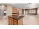 Open concept kitchen area with tiled floors, cabinets, and stone countertops at 1072 E Jade Dr, Chandler, AZ 85286