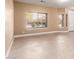 Bright, spacious living room boasts neutral tones and tile flooring at 1072 E Jade Dr, Chandler, AZ 85286