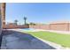 Backyard pool area, landscaping, turf lawn, and privacy wall at 1072 E Jade Dr, Chandler, AZ 85286