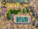 Aerial view of a community amenity featuring tennis court, putting green, turf, bocce ball and BBQ area at 10799 E Florence Way, Scottsdale, AZ 85262