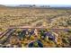 Aerial view of luxury homes in desert landscape, complete with mountain views at 10799 E Florence Way, Scottsdale, AZ 85262