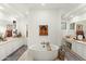 Luxurious bathroom features a standalone tub, dual vanities, and stylish fixtures for a spa-like retreat at 10799 E Florence Way, Scottsdale, AZ 85262