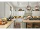 Well-appointed kitchen features a large island, custom cabinetry, and high-end finishes at 10799 E Florence Way, Scottsdale, AZ 85262