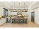 Gourmet kitchen with a large central island, stainless steel appliances, and custom cabinetry at 10799 E Florence Way, Scottsdale, AZ 85262