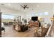 Spacious living room with large windows and access to outdoor living area, great for entertaining at 10799 E Florence Way, Scottsdale, AZ 85262