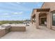 The outdoor kitchen features a built-in grill, countertop space, and the patio also offers views of the pool at 10799 E Florence Way, Scottsdale, AZ 85262