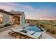 Backyard pool with lounge chairs and outdoor bar area at 10799 E Florence Way, Scottsdale, AZ 85262
