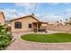 Expansive backyard with low-maintenance landscaping and a covered patio at 11163 E Laurel Ln, Scottsdale, AZ 85259