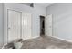 Empty bedroom featuring carpet flooring and closet doors at 11163 E Laurel Ln, Scottsdale, AZ 85259