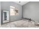 Empty bedroom with a large window and carpet flooring at 11163 E Laurel Ln, Scottsdale, AZ 85259