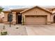 Charming single-story home featuring desert landscaping and a two-car garage at 11163 E Laurel Ln, Scottsdale, AZ 85259