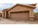 Garage and desert landscaping at 11163 E Laurel Ln, Scottsdale, AZ 85259