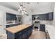 Stylish kitchen featuring an island, plenty of cabinet space, and stainless steel appliances at 11163 E Laurel Ln, Scottsdale, AZ 85259
