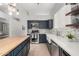 Well-equipped kitchen boasts an island, modern appliances, backsplash, and ample counter space for cooking at 11163 E Laurel Ln, Scottsdale, AZ 85259