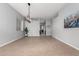 Bright living room featuring tile flooring, modern lighting, and neutral wall color at 11163 E Laurel Ln, Scottsdale, AZ 85259