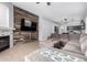 Open-concept living room boasts a fireplace, accent wall, and easy access to the kitchen at 11163 E Laurel Ln, Scottsdale, AZ 85259