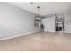 Spacious living room featuring tile flooring, modern lighting, and ample natural light at 11163 E Laurel Ln, Scottsdale, AZ 85259