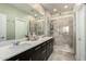 Elegant bathroom featuring a double vanity, a spacious walk-in shower, and modern fixtures for a spa-like experience at 11571 E Chevelon Trl, Gold Canyon, AZ 85118