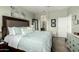 Stylish bedroom with a comfortable bed, coordinated décor, and access to an en-suite bathroom and closet at 11571 E Chevelon Trl, Gold Canyon, AZ 85118