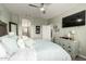Well-appointed bedroom featuring a flat-screen TV, coordinated décor, and convenient access to an en-suite bathroom at 11571 E Chevelon Trl, Gold Canyon, AZ 85118