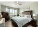 Comfortable bedroom showcasing a well-made bed, neutral walls, ample natural light, and cozy décor at 11571 E Chevelon Trl, Gold Canyon, AZ 85118