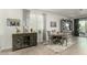 Elegant dining area features stylish furnishings, a decorative buffet cabinet, and a view of the outdoors at 11571 E Chevelon Trl, Gold Canyon, AZ 85118