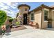 Inviting front entrance features unique architectural details, stone accents, and a cozy sitting area at 11571 E Chevelon Trl, Gold Canyon, AZ 85118