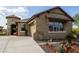 Charming single-story home with well-manicured landscaping and a welcoming front entrance at 11571 E Chevelon Trl, Gold Canyon, AZ 85118