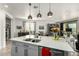 Modern kitchen island with pendant lighting, ample counter space, and seating for casual dining at 11571 E Chevelon Trl, Gold Canyon, AZ 85118