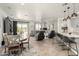 Open-concept living space with a blend of dining, living, and kitchen areas, perfect for modern living at 11571 E Chevelon Trl, Gold Canyon, AZ 85118