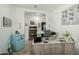Well-lit office with gray chair, spacious desk, and convenient mini fridge at 11571 E Chevelon Trl, Gold Canyon, AZ 85118