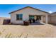 Shot of the back of the home with a patio and desert landscaping at 11738 S 173Rd Ln, Goodyear, AZ 85338