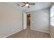 Neutral bedroom with ceiling fan and natural light at 11738 S 173Rd Ln, Goodyear, AZ 85338