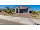 Inviting single-Gathering home with a brick driveway and desert landscaping at 11738 S 173Rd Ln, Goodyear, AZ 85338