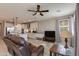 Open concept living room featuring recessed lighting, ceiling fan, and view into modern kitchen at 11738 S 173Rd Ln, Goodyear, AZ 85338