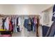 Spacious walk-in closet with ample hanging space for clothes and accessories at 11738 S 173Rd Ln, Goodyear, AZ 85338