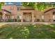 Back of home with a spacious grassy yard and patios, perfect for outdoor living at 125 S 56Th St # 100, Mesa, AZ 85206